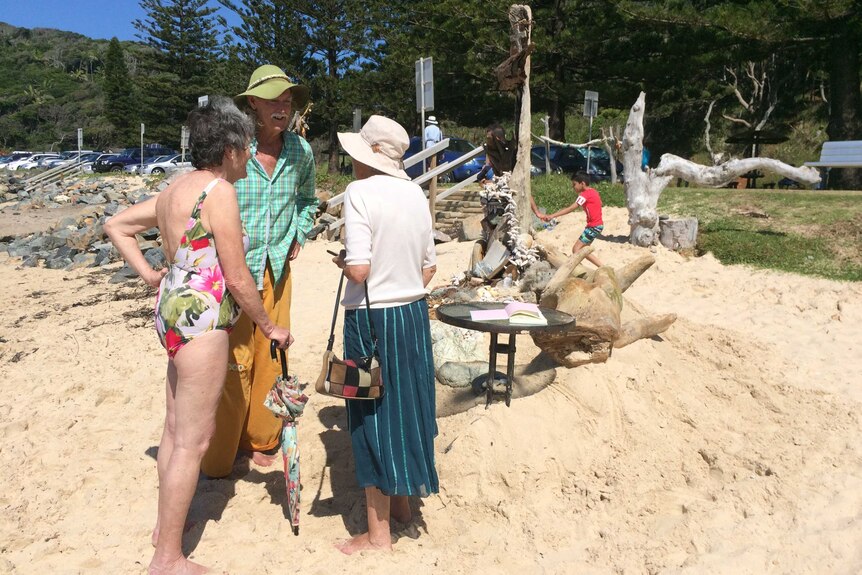Rick Thomson-Jones  makes time to stop and chat with locals and visitors, at one of his beach sculptures.
