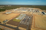 An aerial shot of an industrial plant. Looks like big brown squares 