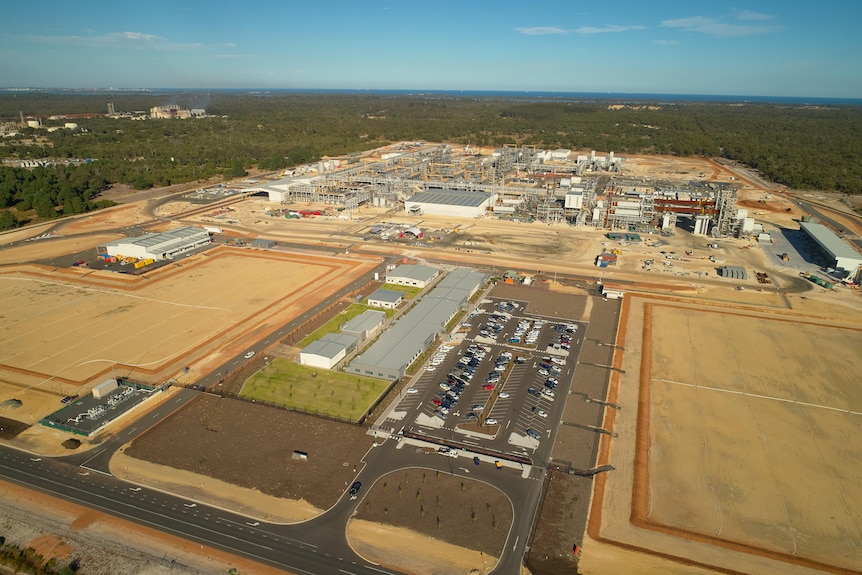 An aerial shot of an industrial plant. Looks like big brown squares.