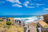 Tourists viewing and taking photos of the Twelve Apostles
