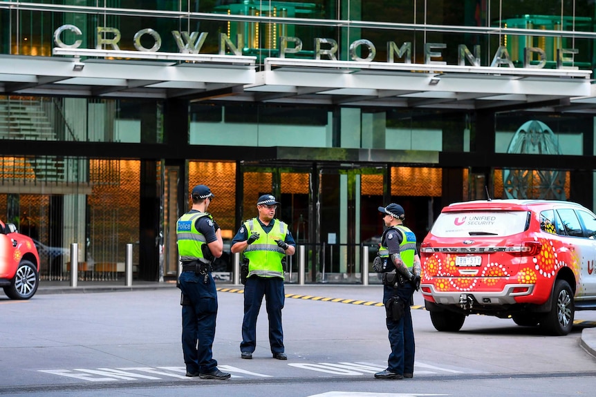 Police guard a quarantine hotel