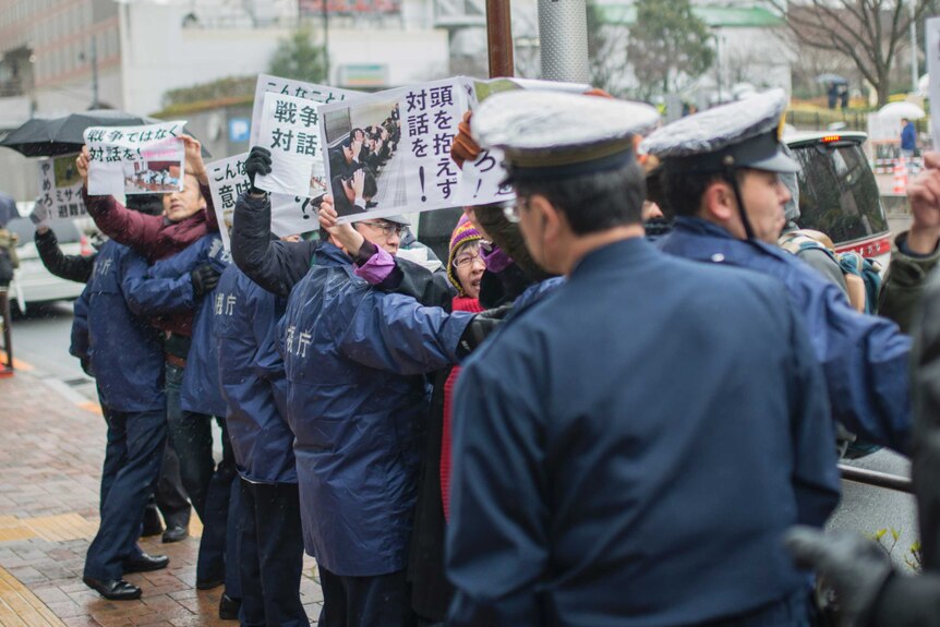 Anti-war protesters during Japan's ballistic missile evacuation drill
