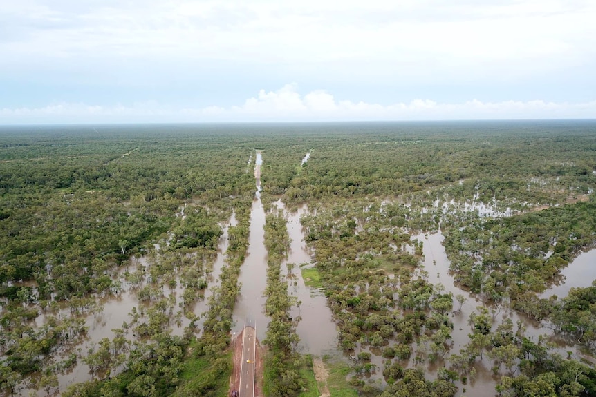 an aerial view of a flooded rural road