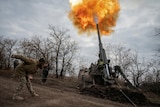 Ukrainian soldier firing a weapon.