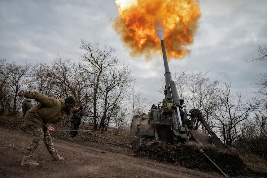 Ukrainian soldier firing a weapon.