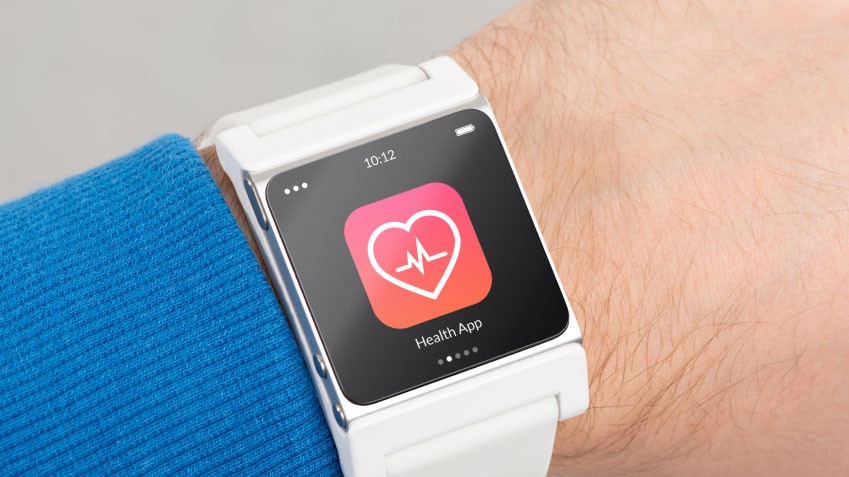 A man's wrist with a smart watch displaying a health app.