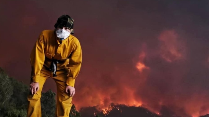 19-year-old India MacDonell with fire burning in ranges behind her.