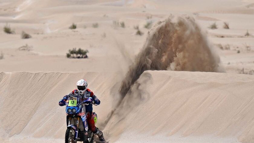 France's David Fretigne rides his Yamaha over a dune during stage three of the Dakar 2010.