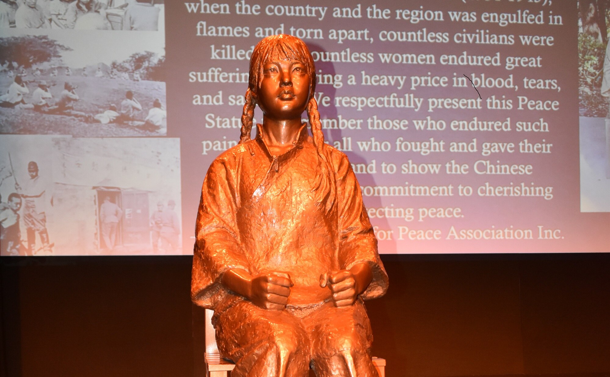 Chinese peace statue debuted at a community commenorative event 