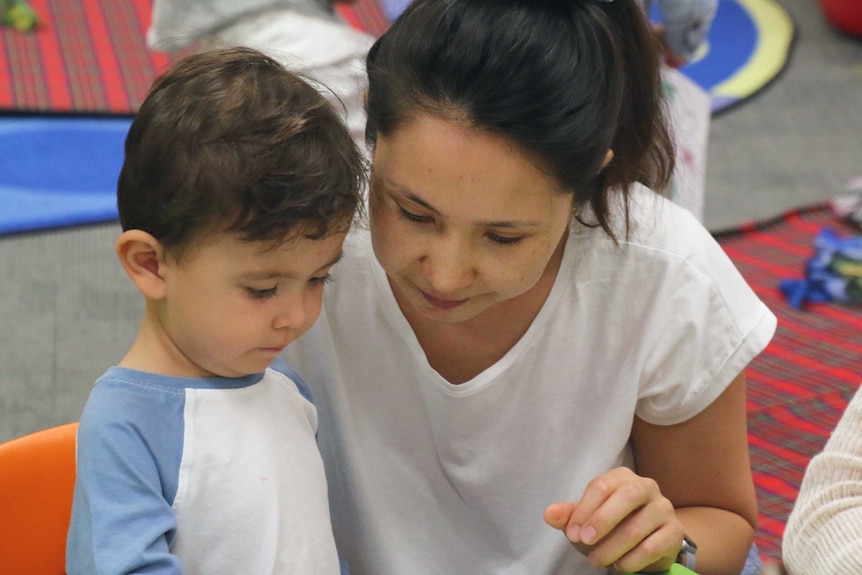 Mother reads to her child