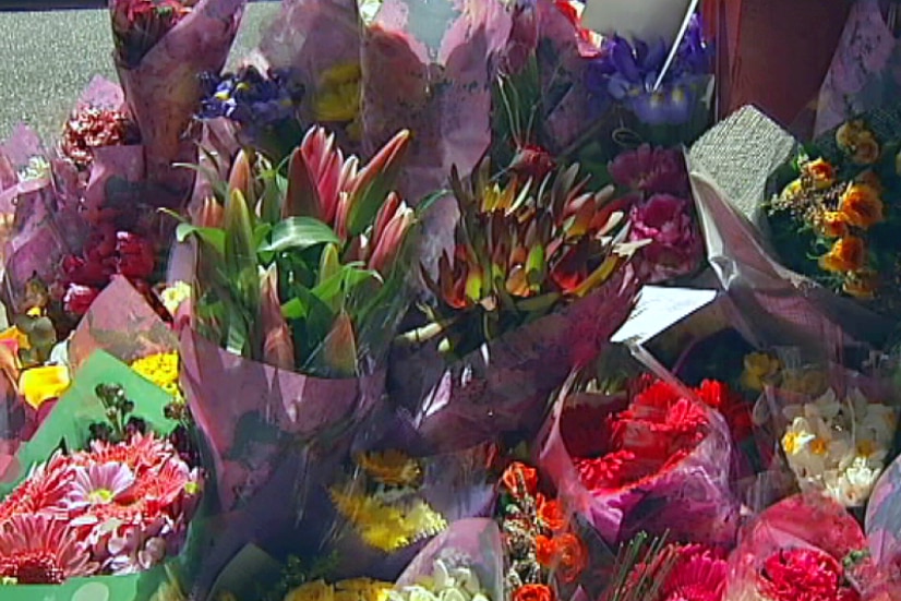 Flowers left at the Carrum Downs shopping centre in memory of Andrea Lehane.