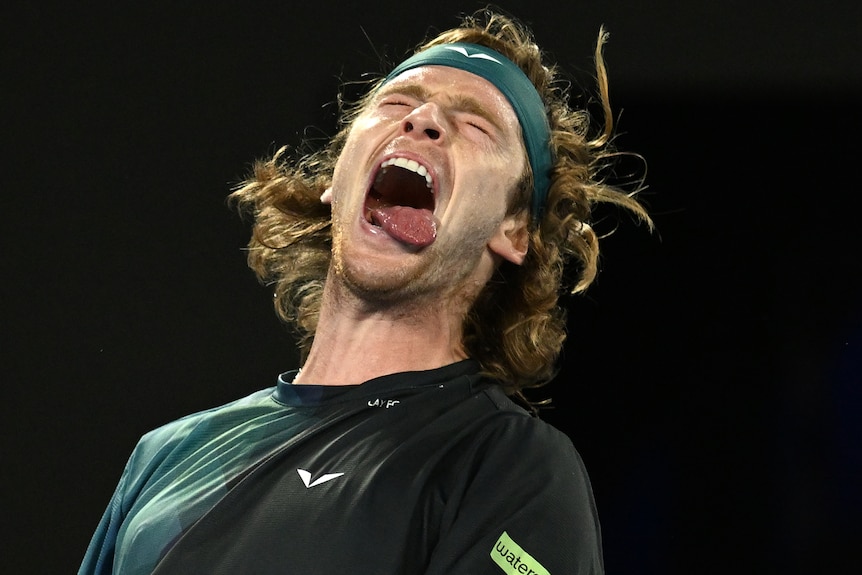 Andrey Rublev shakes his head as he reacts during 2024 Australian Open match.