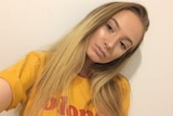 Murder victim Larissa Beilby in yellow t-shirt with blonde written on it