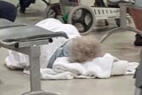 Facebook image of 95 year old woman on hospital floor in Hobart