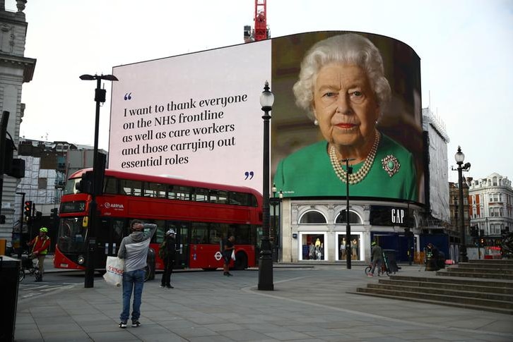 A message from Britain's Queen Elizabeth II is displayed on a screen in Piccadilly Circus.