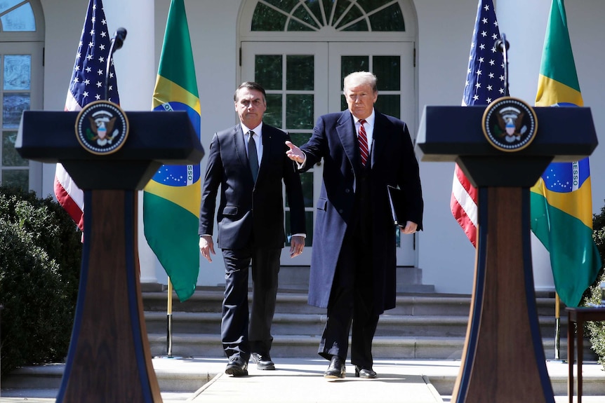 Bolsonaro and Trump side by side.