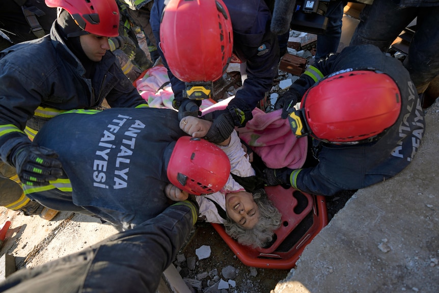 Rescue teams evacuate a survivor from the rubble of a destroyed building in Kahramanmaras, southern Turkey.