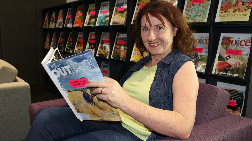 Librarian Carmel Stuart relaxes in a lounge area at the new Toowoomba city library