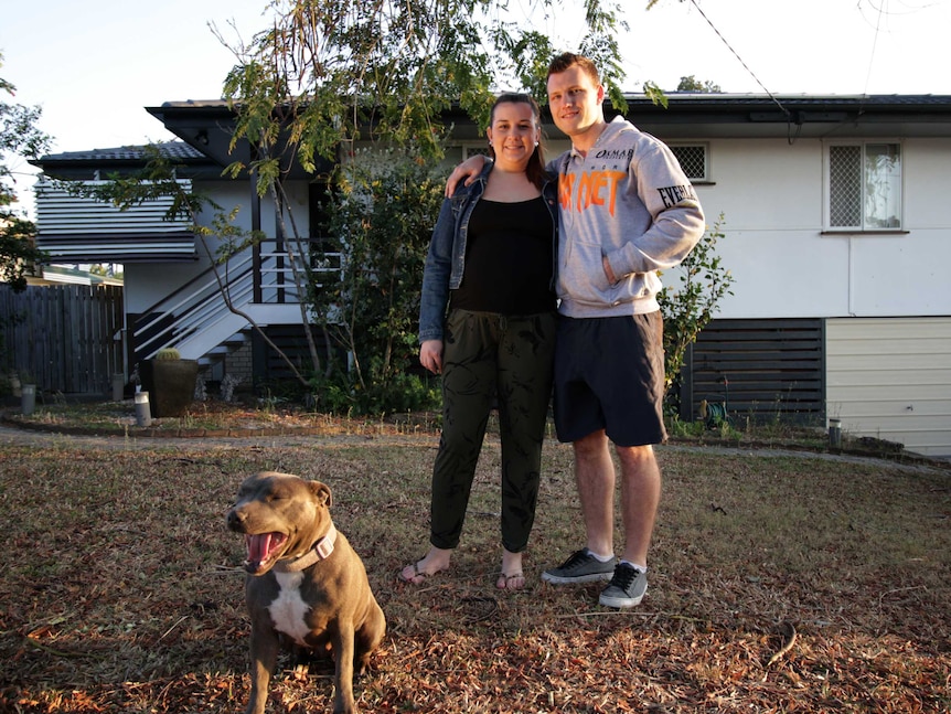 Jeff and Jo Horn with their dog, Lexie, outside their Brisbane home.