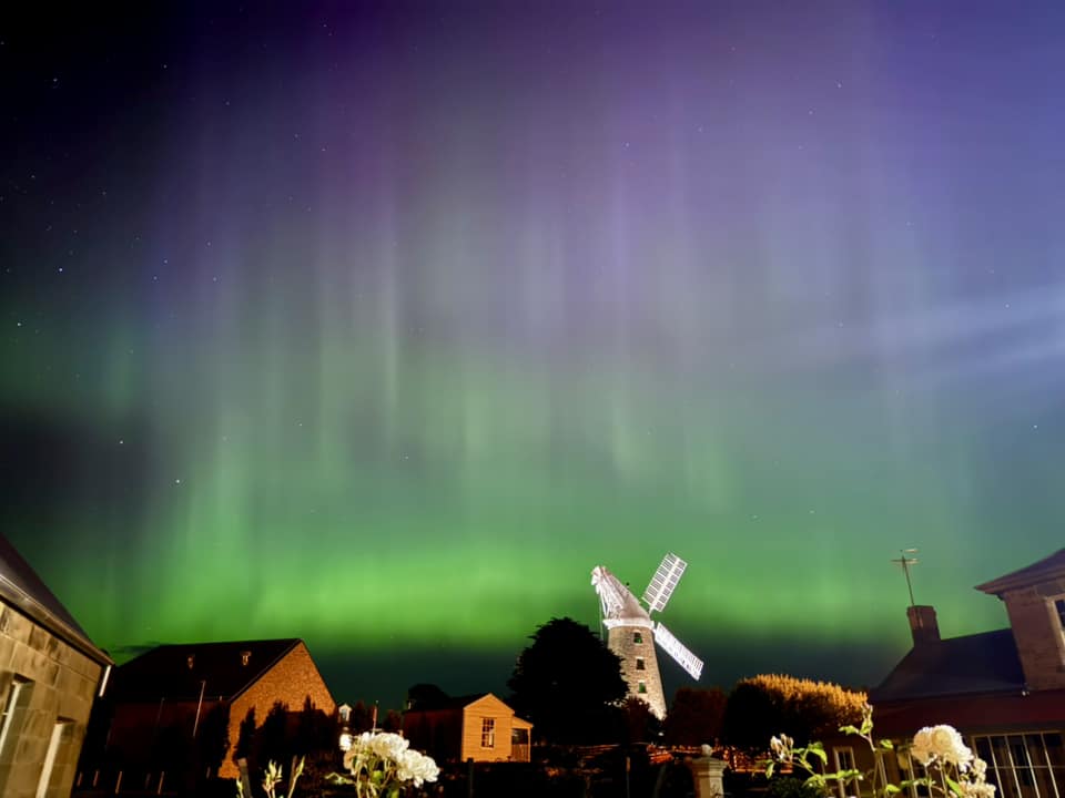 Southern lights over a windmill