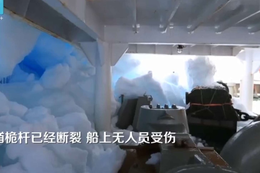 Part of the Chinese icebreaker Snow Dragon covered in snow and ice, after the vessel hit an iceberg.