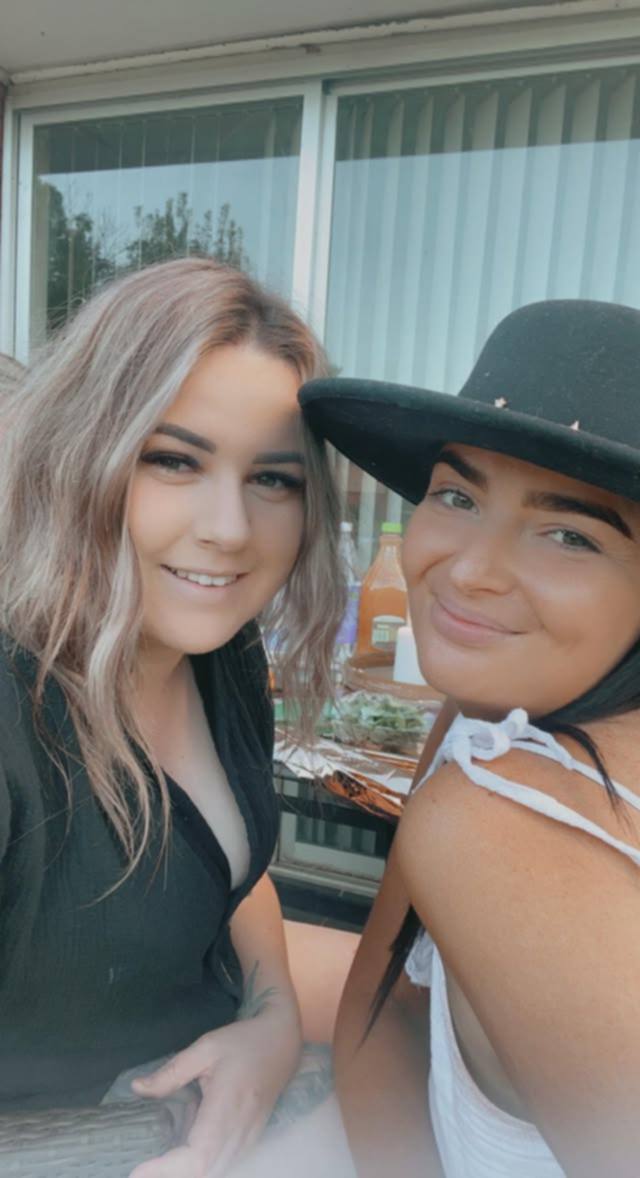 Two women smiling at camera