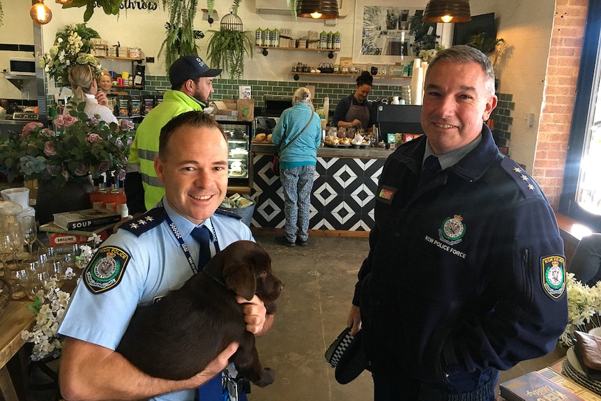 Detective Sergeant Tom Aylett and Inspector Trent Swinton getting a coffee in Walgett