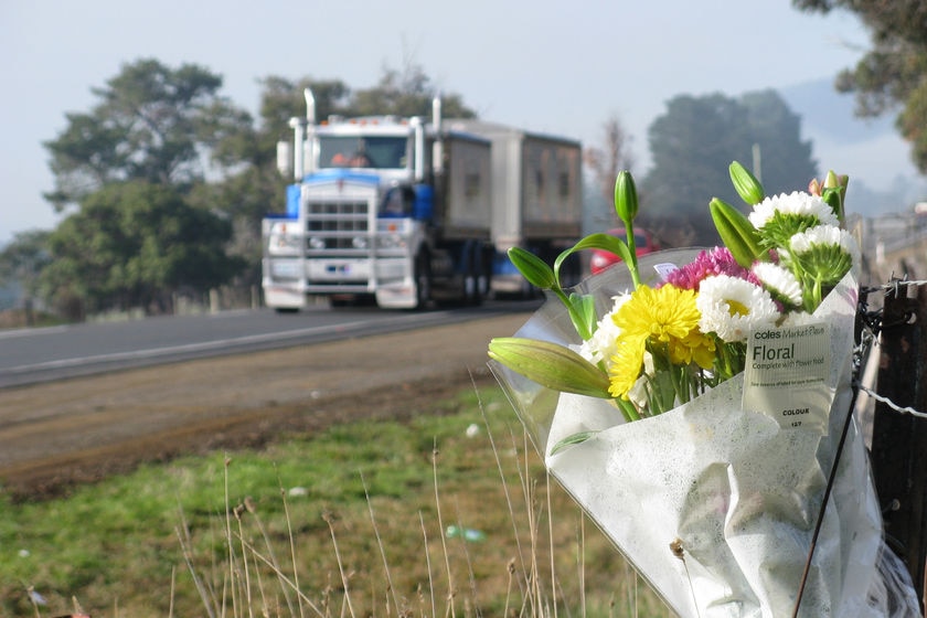 Flowers next to the highway at the Mangalore crash scene.