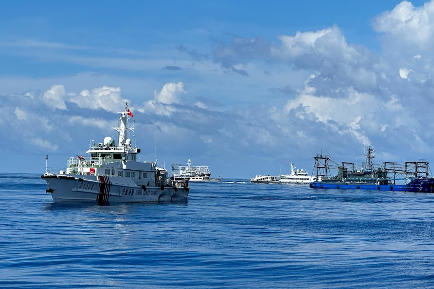 Dozens of Chinese ships chase Philippine coast guard