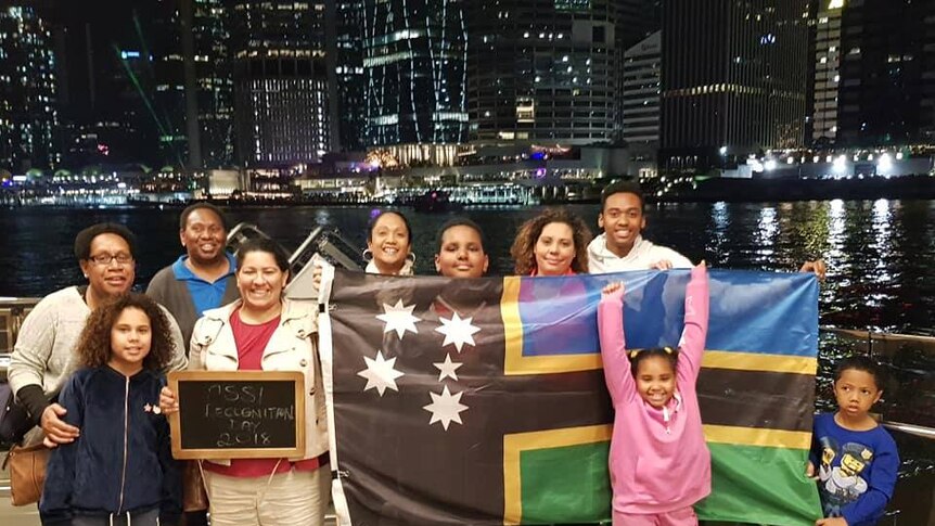 People with Australian South Sea Islander flag