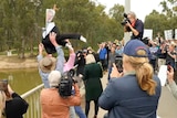 Effigy of Water Minister thrown in river