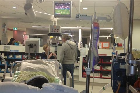 Quadriplegic football Casey Tutungi watches AFL from his hospital bed