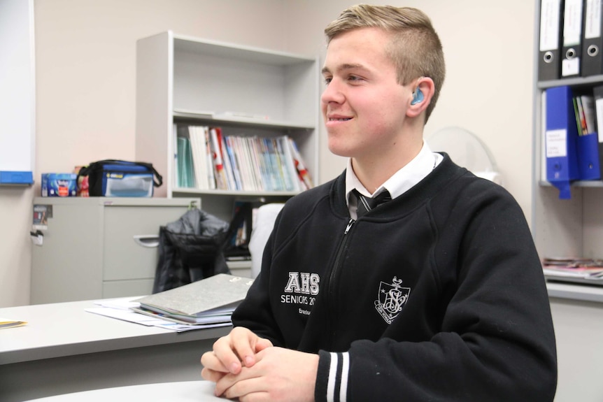 SA Year 12 student Brenton Peters sitting at a desk