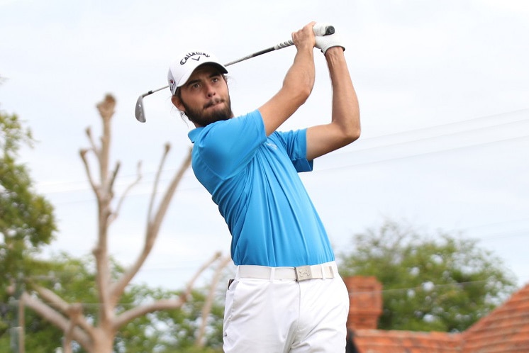 Curtis Luck swinging a golf club.