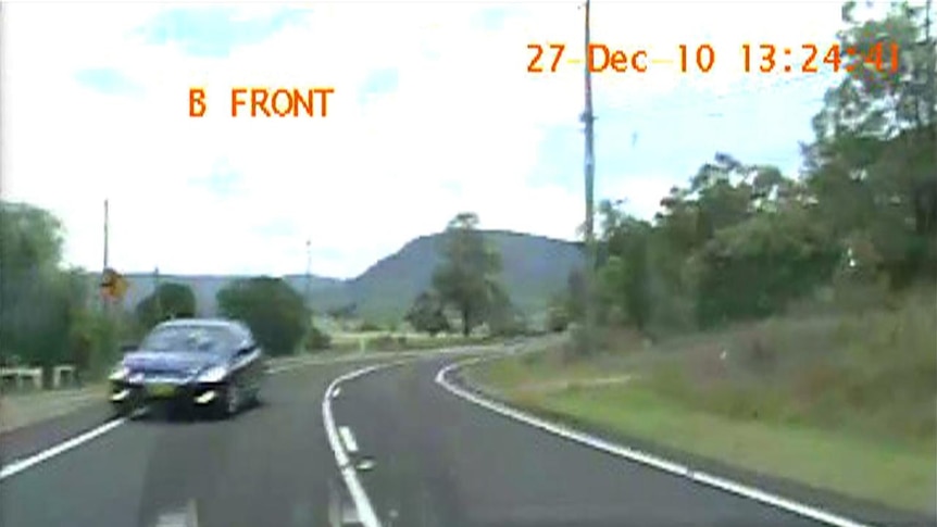 A car difts onto the wrong side of the Golden Highway