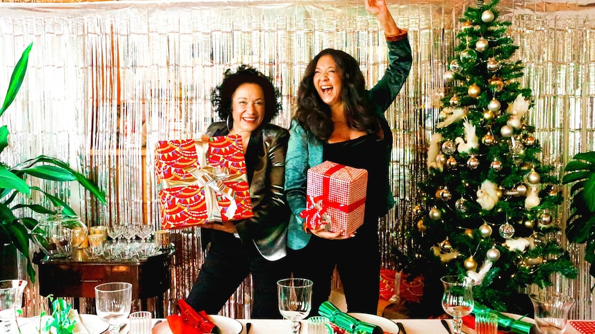 Australian singers Vika and Linda Bull pictured at a Christmas party with presents