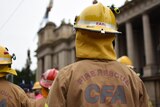 A Country Fire Authority firefighter rallies outside Victoria's Parliament