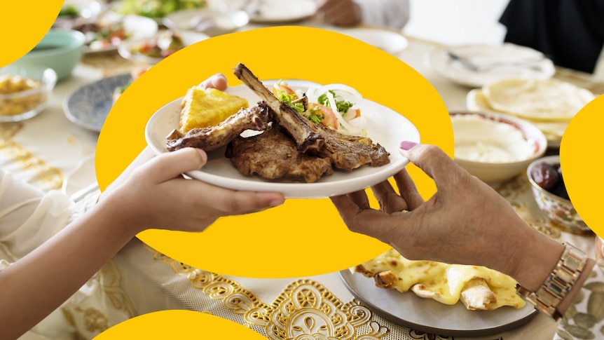 A close up shot of hands holding up plates of food during a Ramadan feast.