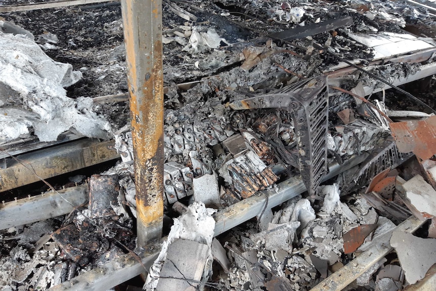 A group of batteries surrounded by ash