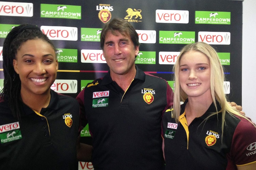 (LtoR) Brisbane Lions player Sabrina Frederick-Traub, coach Craig Starcevich, and fellow player Tayla Harris
