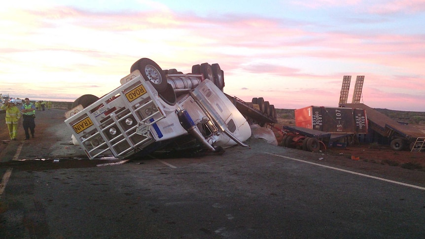 The driver crawled out of the cab of this overturned road train near Cue