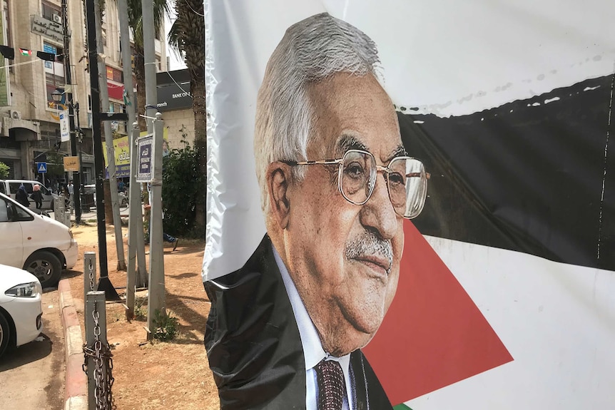 Flag depicting Mahmoud Abbas in Palestine