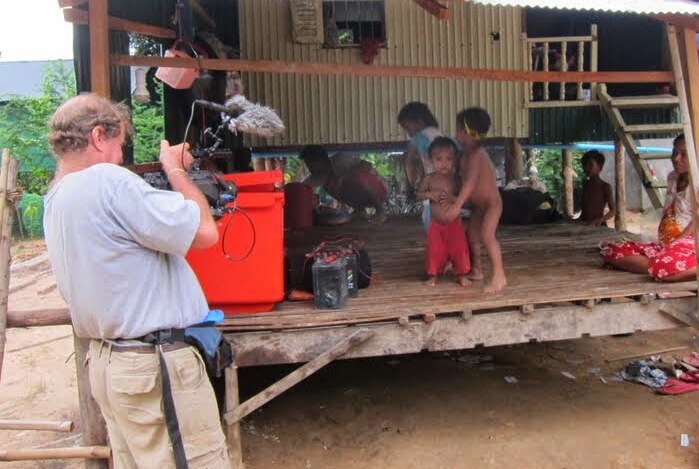 James Ricketson filming some children playing in Cambodia