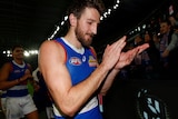 Marcus Bontempelli applauds fans while leaving the field