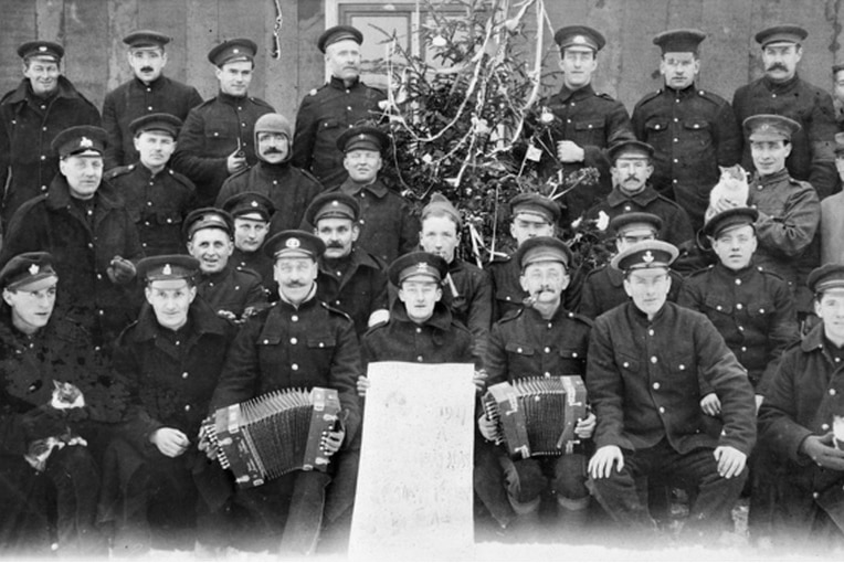 WWI portrait of group of soldiers with a Christmas tree