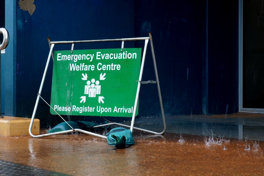 Evacuation centre sign in the rain