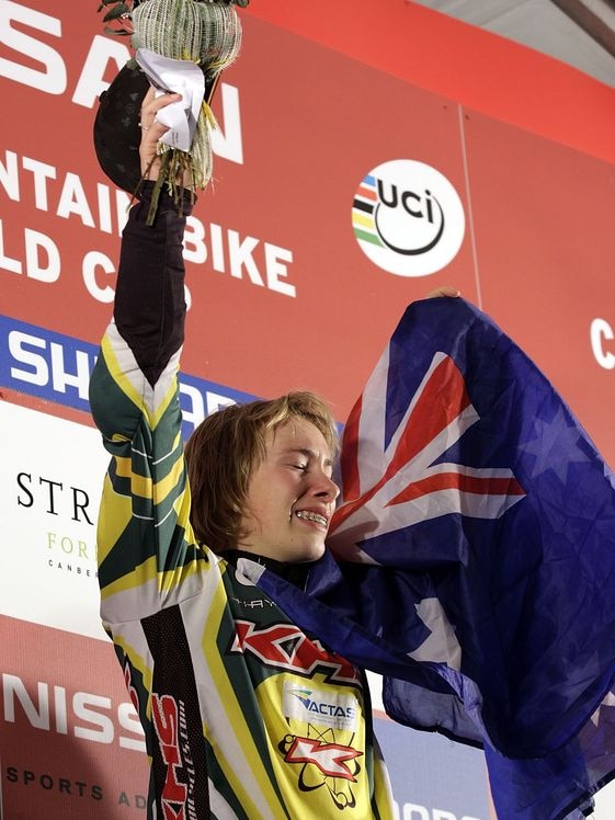 Caroline Buchanan of Australia stands on the podium after winning the Woman's 4 Cross, August 2008