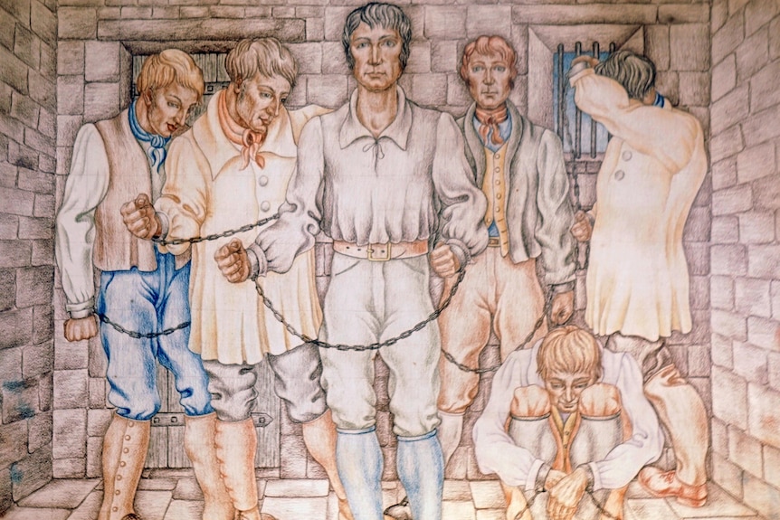 A painting of six men in white clothing and shackles, inside a cell
