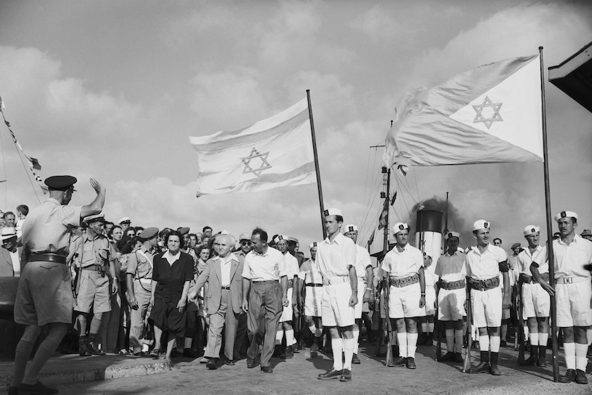 Israel's Prime Minister, David Ben Gurion with his wife and friends, seeing last contingent of British troops leave Israel. 