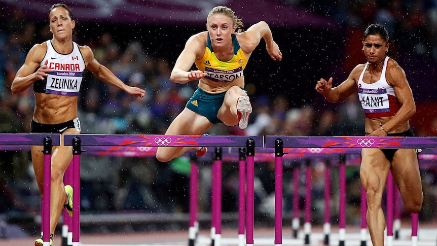 Australia's Sally Pearson wins the 100m hurdles final as rain tumbles down at the Olympic Stadium.